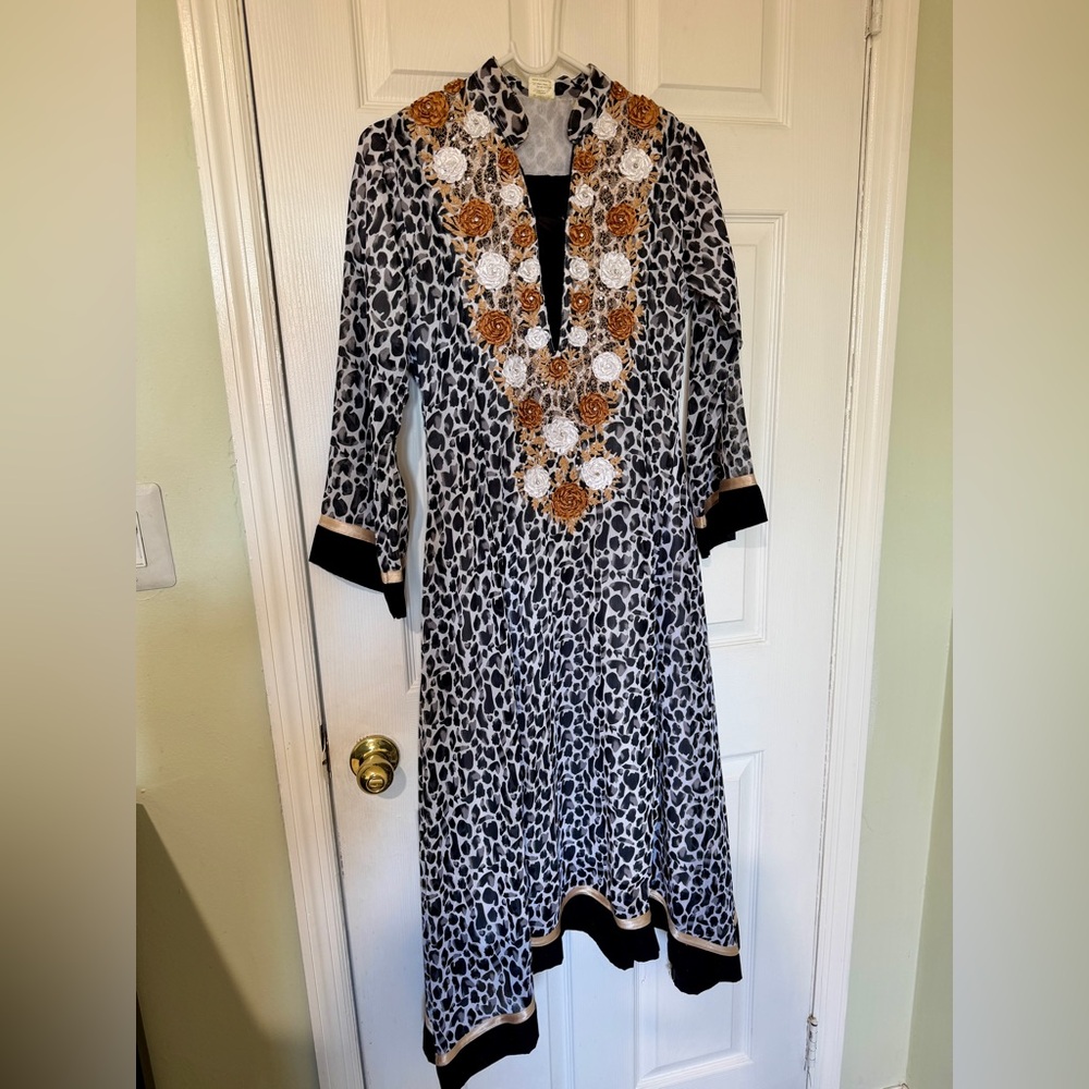 Elegant Black and White Patterned Dress with Gold Accents